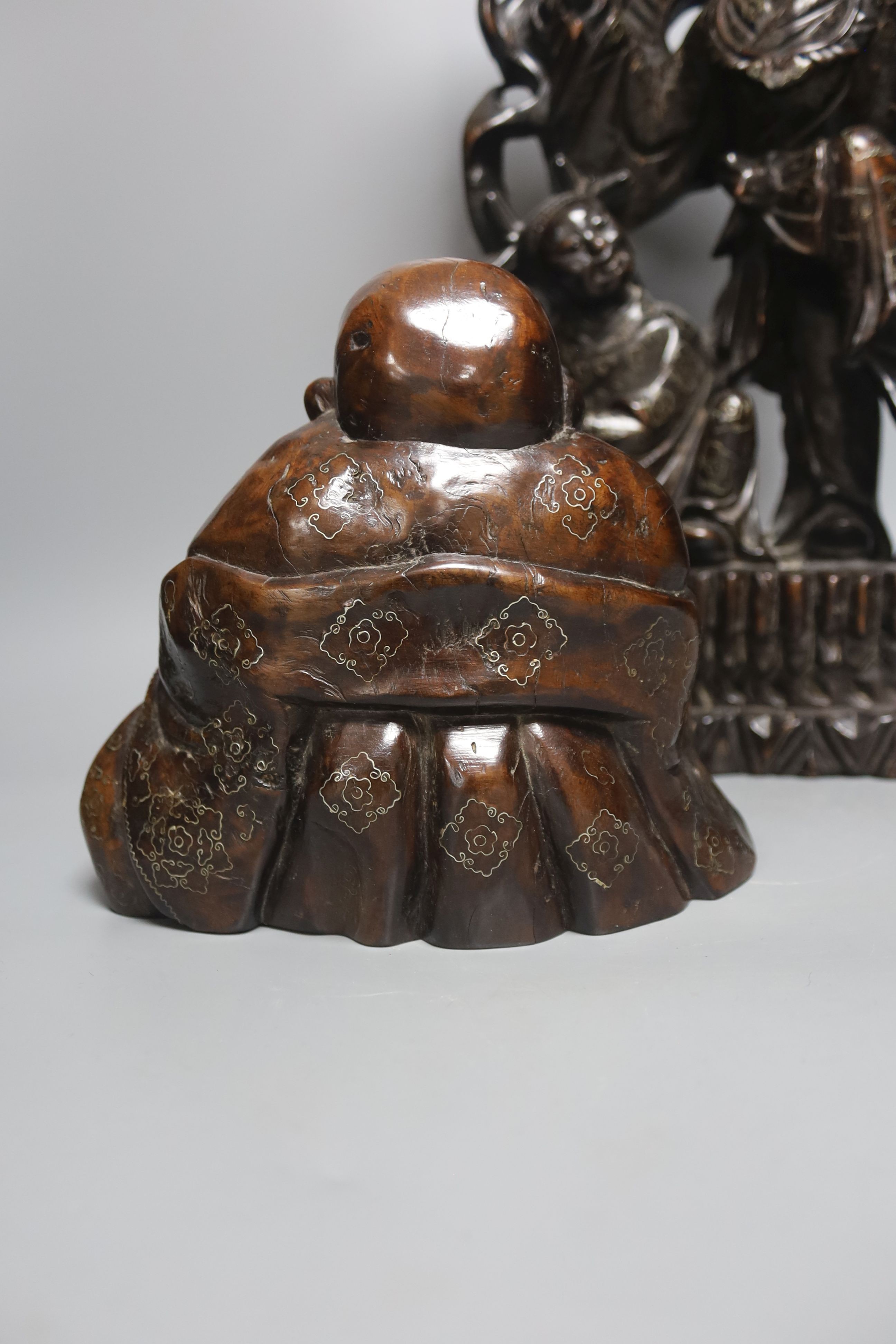 A Chinese hardwood and wire inlaid group of the He He Erxian and a similar figure of Budai, both early 20th century, tallest 49cm
